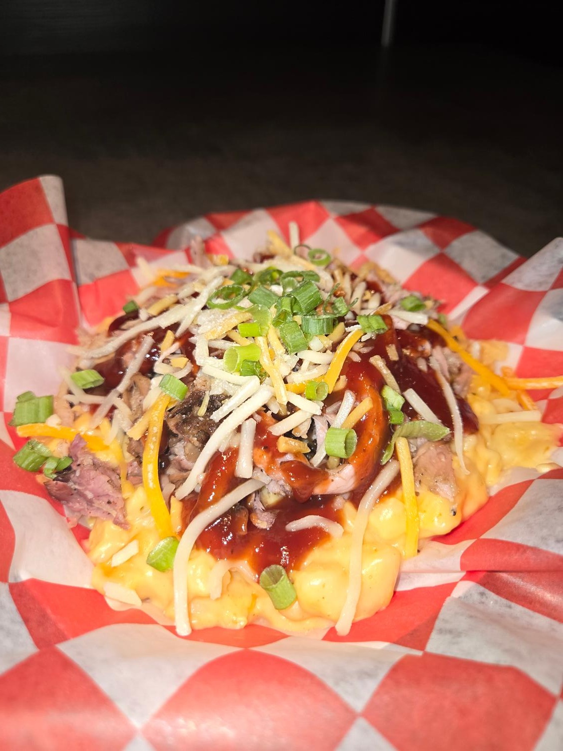 Mac stack bowl with mac and cheese, smoked pork, shredded cheese and green onion